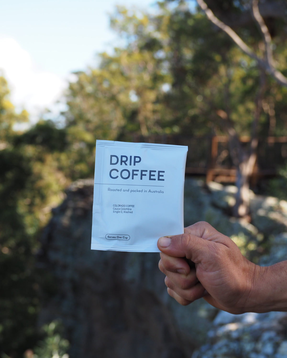 Drip coffee to brew anywhere. Here coffee parachute is pictured over a cliff. 